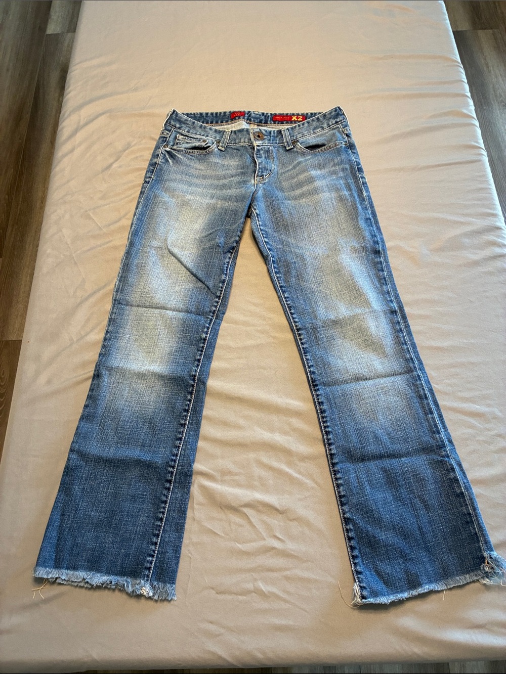 X2 Faded Blue Flare Jeans with Raw Hem